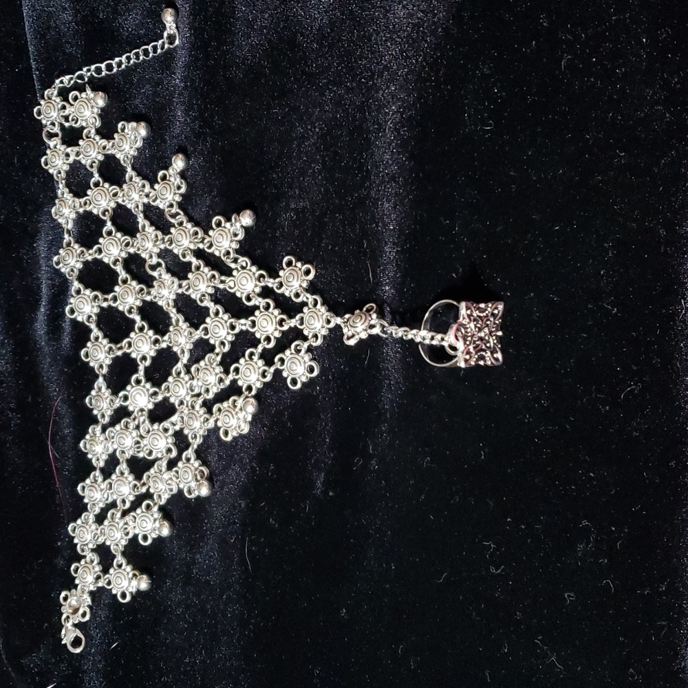Silvertone hand bracelet and ring
